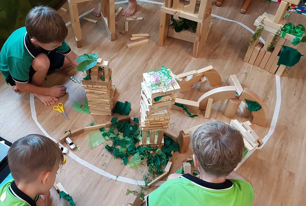 Children build their dream city with green buildings and neighborhoods
